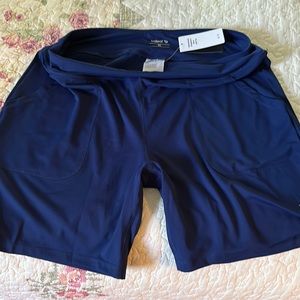 Women’s athletic shorts, two side pockets, size XL, never worn